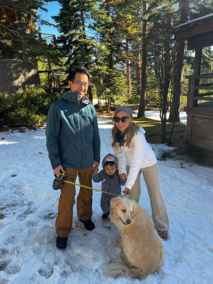 Joyce with her family and their dog, outside in the snow
